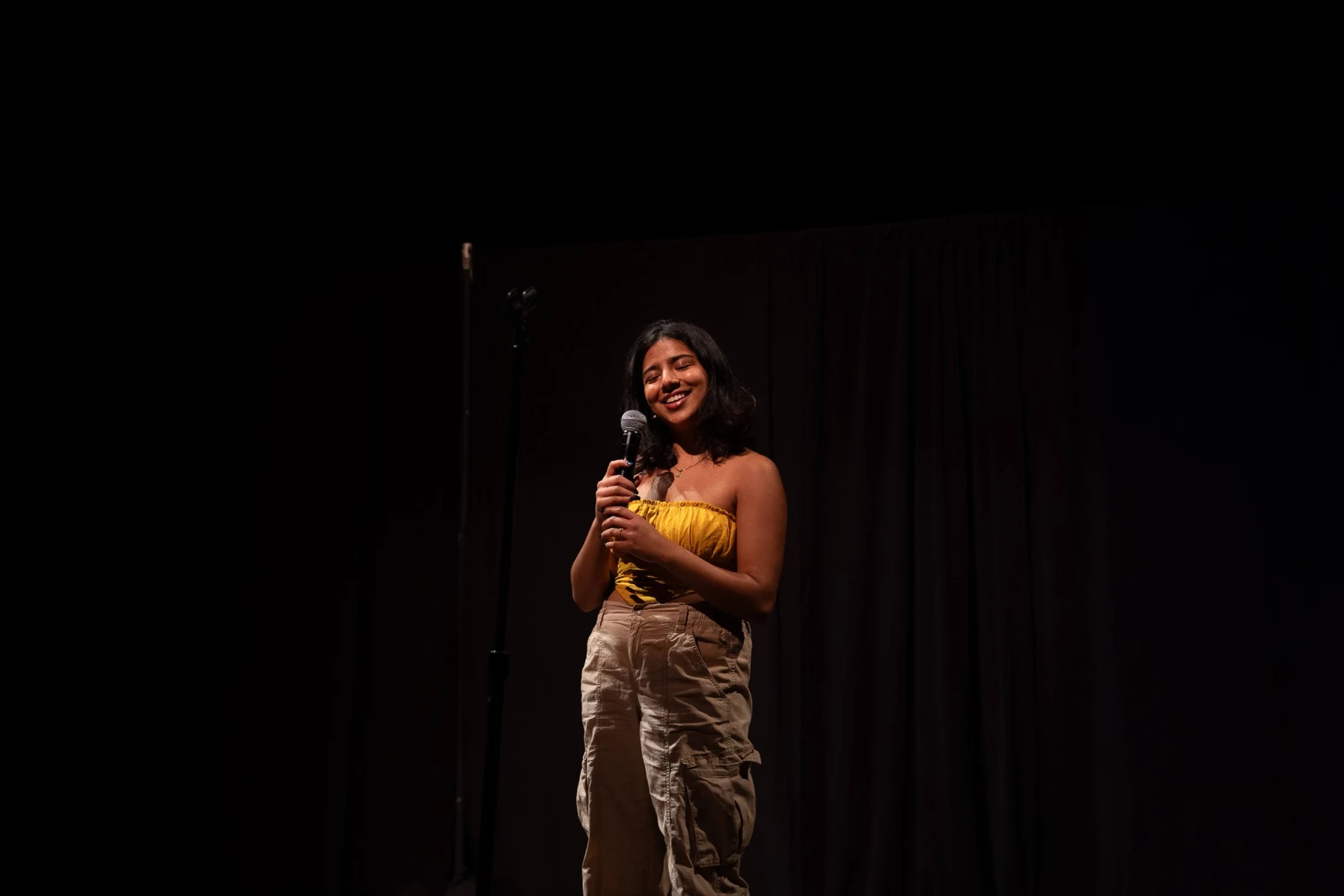 Lavanya Neti performing stand-up comedy on stage